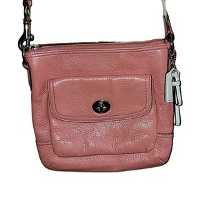 Coach swingpack crossbody leather bag.  EUC. Gold satin interior. Coral exterior